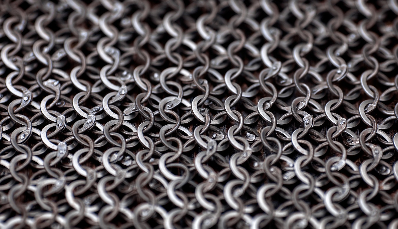Chain-mail or Hauberk texture, metal protective armor of medieval or middle ages times. Hauberk medieval knight equipment shirt of ring mail
