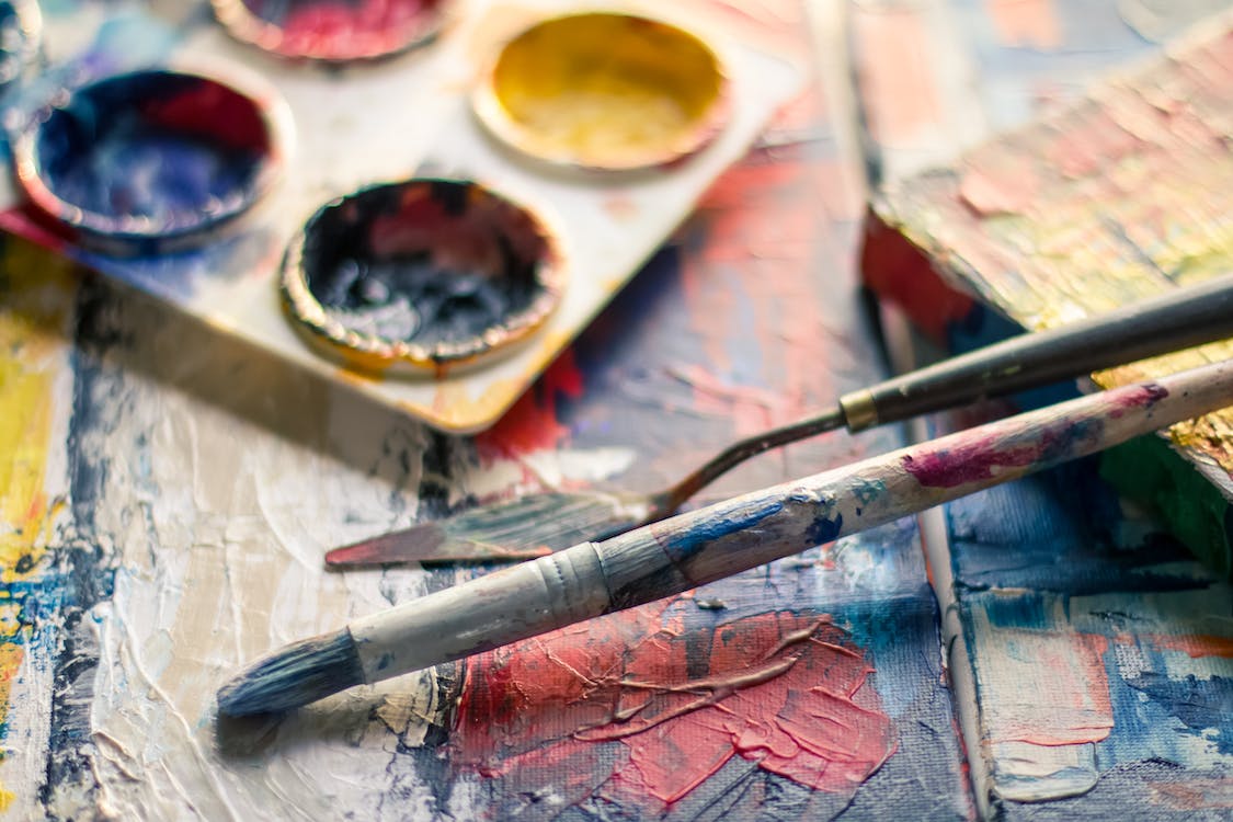 Selective-Focus-Photography-of-Paintbrush-Near-Paint-Pallet