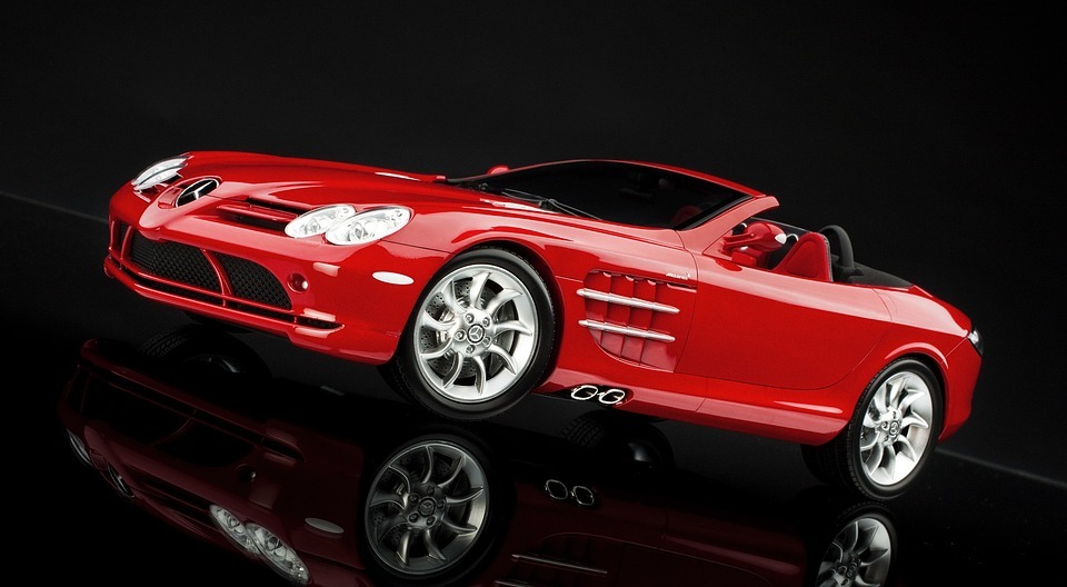 a red Mercedes SLR McLaren in a black background