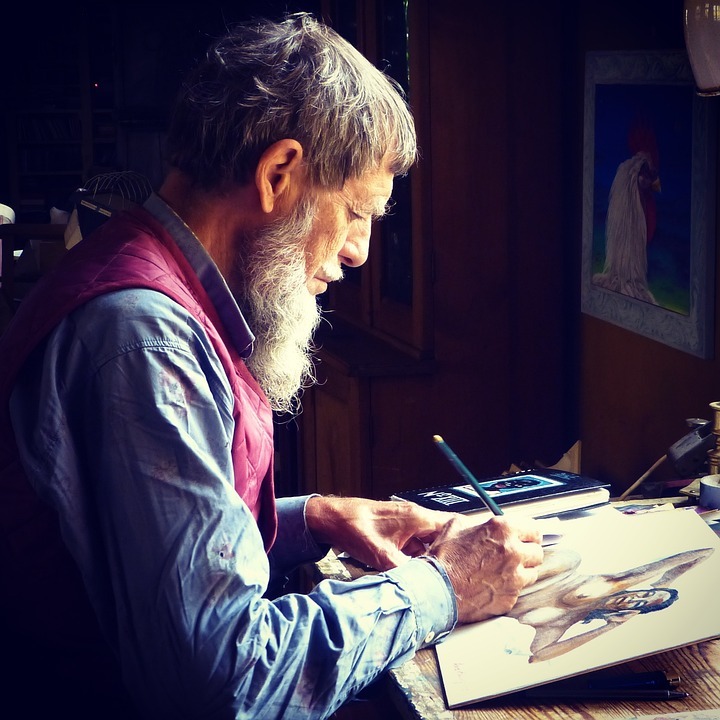 Senior man creating a painting