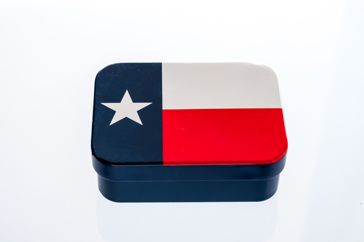 a tin can designed with the Texas state flag
