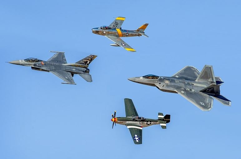 four military aircraft, black aircraft