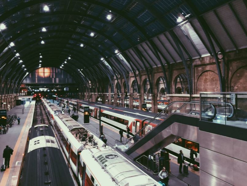 train station, people walking in a train station, trains