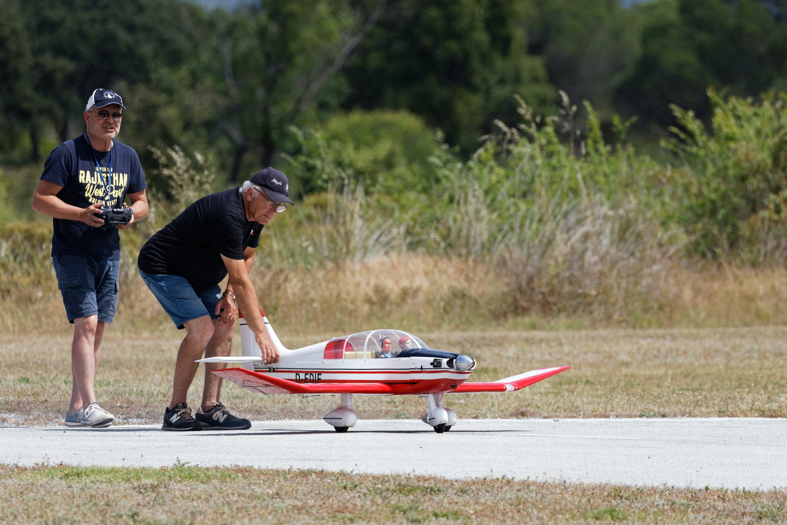 Men-with-Remote-Controlled-Airplane